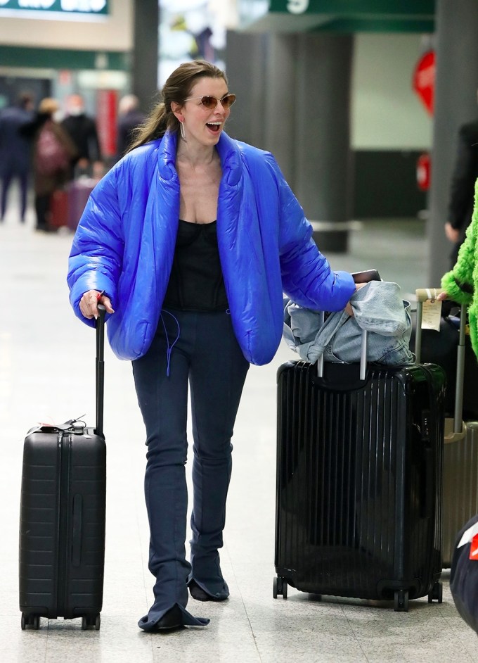 Julia Fox wears a blue Yeezy jacket as she arrives in Milan for Fashion Week