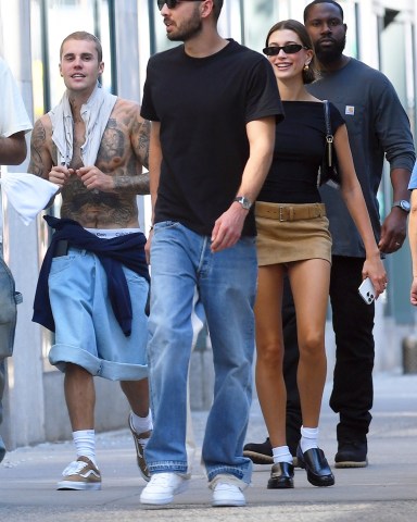 New York, NY  - *EXCLUSIVE*Hot in the City?Justin Bieber goes shirtless showing off his tattoos and Calvin Klein's during an out with his wife Hailey and friends in Tribeca, New York on Wednesday.Pictured: Justin Bieber, Hailey BieberBACKGRID USA 11 MAY 2023 USA: +1 310 798 9111 / usasales@backgrid.comUK: +44 208 344 2007 / uksales@backgrid.com*UK Clients - Pictures Containing ChildrenPlease Pixelate Face Prior To Publication*