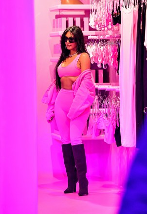 EXCLUSIVE: Kim Kardashian looked hot in pink as she made a surprise appearance at her Valentine's Skims pop up at the Century City Westfield Center Mall in Beverly Hills, CA. The reality star & fashion icon was mobbed as she surprised fans while visiting the pop up which was set up in the center of the mall, but didn't shy away as she took her time taking selfies and greeting her most loyal fans. Kim even brought her own lighting and camera crew to document the special moment as she hung out with her fans and employees for about an hour. 08 Feb 2023 Pictured: Kim Kardashian. Photo credit: @CelebCandidly / MEGA TheMegaAgency.com +1 888 505 6342 (Mega Agency TagID: MEGA941311_037.jpg) [Photo via Mega Agency]