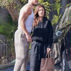 *EXCLUSIVE* Minka Kelly gets help with her luggage from her hunky Imagine Dragons boyfriend Dan Reynolds