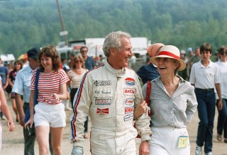 Actor Paul Newman and his wife, Joanne Woodward, smile at one another as they walked through the paddock area at Lime Rock Park race track in Lime Rock . Newman was to drive in a Sports Car Club of America GT-1 race and Woodward was walking him to his car. Newsman won the 30-lap race at an average speed of 91.91 miles-per-hour
Lime Rock Park, Lime Rock, USA