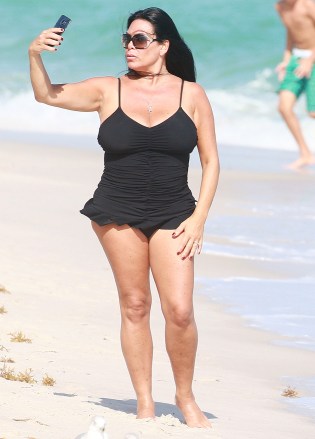 Renee Graziano
Renee Graziano out and about, Miami Beach, USA - 01 Jan 2017
Mob Wives star Renee Graziano taking selfies at the beach wearing a black one piece swimsuit