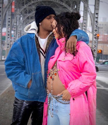 Rihanna is set to be a Mom for the very first time ! She was spotted out in NYC with Boyfriend, ASAP Rocky this weekend, shocking the world with her baby bump on full display. The inseparable pair stepped out in Harlem, his hometown, and were seen looking happier than ever. Rihanna’s bare bump was adorned by an elegant gold cross with colorful jewels, as she leaned into her boyfriend’s tender kiss on her forehead. She looked absolutely radiant as they enjoyed a walk in the snowy brisk air together before headed back to their new apartment together to prepare for parenthood.  MANDATORY BYLINE - DIGGZY/Shutterstock