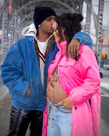 Rihanna is set to be a Mom for the very first time ! She was spotted out in NYC with Boyfriend, ASAP Rocky this weekend, shocking the world with her baby bump on full display. The inseparable pair stepped out in Harlem, his hometown, and were seen looking happier than ever. Rihanna’s bare bump was adorned by an elegant gold cross with colorful jewels, as she leaned into her boyfriend’s tender kiss on her forehead. She looked absolutely radiant as they enjoyed a walk in the snowy brisk air together before headed back to their new apartment together to prepare for parenthood.  
MANDATORY BYLINE - DIGGZY/Shutterstock