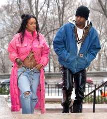 Rihanna is set to be a Mom for the very first time ! She was spotted out in NYC with Boyfriend, ASAP Rocky this weekend, shocking the world with her baby bump on full display. The inseparable pair stepped out in Harlem, his hometown, and were seen looking happier than ever. Rihanna’s bare bump was adorned by an elegant gold cross with colorful jewels, as she leaned into her boyfriend’s tender kiss on her forehead. She looked absolutely radiant as they enjoyed a walk in the snowy brisk air together before headed back to their new apartment together to prepare for parenthood. MANDATORY BYLINE - DIGGZY/Shutterstock