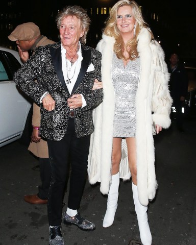 London, UNITED KINGDOM  - Rod Stewart & Penny Lancaster leaving Annabel's in Mayfair, London after celebrating the members club 4th Birthday. Penny was seen having a wardrobe malfunction as she left the venue. Rod was seen arguing with a fan who asked for an autograph on a Celtic shirt with the singer's name on the back but Rod refused to sign the shirt and become annoyed and immediately got in his car and left.  Pictured: Rod Stewart, Penny Lancaster  BACKGRID USA 10 MARCH 2022   BYLINE MUST READ: Click News and Media / BACKGRID  USA: +1 310 798 9111 / usasales@backgrid.com  UK: +44 208 344 2007 / uksales@backgrid.com  *UK Clients - Pictures Containing Children Please Pixelate Face Prior To Publication*