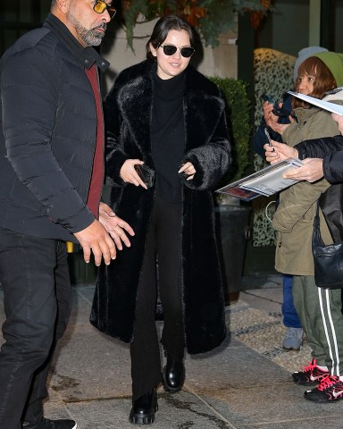 New York, NY  - Selena Gomez wears a fur coat and carries a Luis Vuitton tote while exiting a hotel in NYC this afternoon.Pictured: Selena GomezBACKGRID USA 13 DECEMBER 2022 USA: +1 310 798 9111 / usasales@backgrid.comUK: +44 208 344 2007 / uksales@backgrid.com*UK Clients - Pictures Containing ChildrenPlease Pixelate Face Prior To Publication*