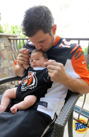 Nick Lachey and his infant son wear matching black and orange Cincinnati Bengals jerseys in a new ad campaign for Tide.  One-month-old Camden John sits on his famous father's lap in the image, released as part of the laundry detergent brand's Show Us Your Colors promotion.  Tide is urging NFL fans to go to their Facebook page - http://www.facebook.com/tide - or Tide.com to upload a photo of the time they were most proud to wear their team's colors, in a bid to win an all expenses paid trip for two to Super Bowl XLVII in New Orleans, LA.  Camden was born on September 12 to Nick, 38, and wife Vanessa.  *MANDATORY BYLINE - SPLASH NEWS/TIDE.COM* Pictured: Nick Lachey son Camden Ref: SPL446604 121012 NON-EXCLUSIVE Picture by: SplashNews.com Splash News and Pictures USA: +1 310-525-5808 London: +44 (0) 20 8126 1009 Berlin: +49 175 3764 166 photodesk@splashnews.com World Rights