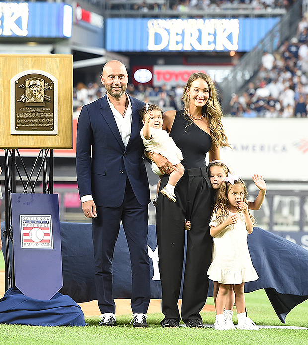 Derek Jeter's sister Sharlee Jeter, left, holds her son Jaden, as retired  New York Yankees shortstop Derek Jeter and his wife Hannah Jeter watch a  video about Jeter's storied career during an