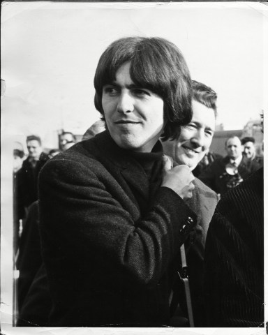 George Harrison At London Airport A Couple Of Weeks Into The Filming Schedule For 'help!' In 1965. 
George Harrison At London Airport A Couple Of Weeks Into The Filming Schedule For 'help!' In 1965.