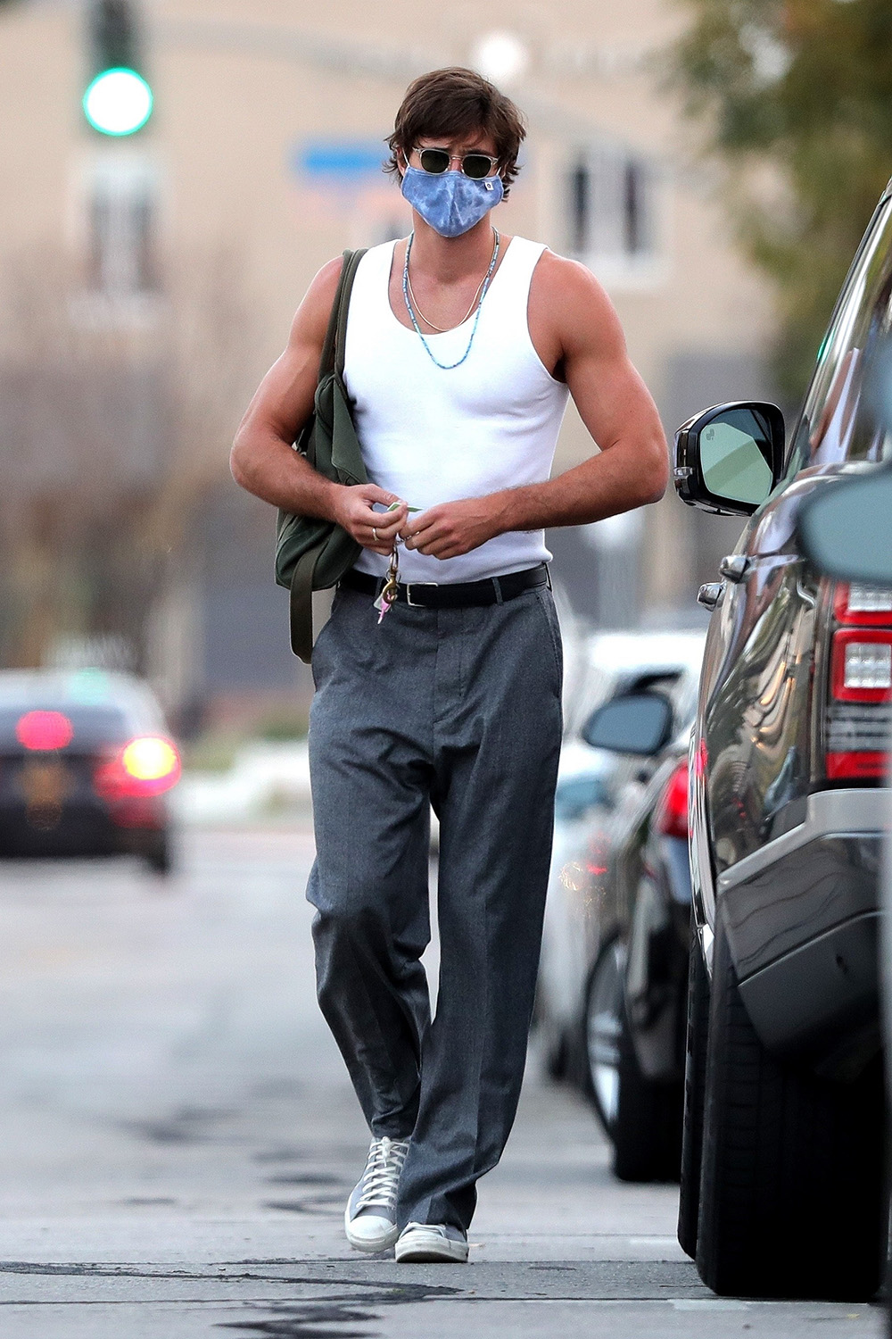 West Hollywood, CA - *EXCLUSIVE* - The sun's not out but the guns are! Jacob Elordi is spotted leaving Dogpound Gym after his workout session this afternoon.