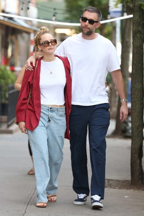 Jennifer Lawrence and Cook Maroney return home after having an early breakfast at La Bonbonnire in New York City's West Village.  Jennifer is wearing jeans, white top, red jacket and sandals.  On the way home the couple walks with their arms around each other!  Image: Jennifer Lawrence, Cooke Maroney Ref: SPL5325126 090722 Non-exclusive Image: Christopher Peterson/SplashNews.com Splash News and Pictures USA: +1 310-525-5808 London: +44 (0) 20 8126 1009 Berlin: +49 175 3764 166 photodesk@splashnews.com world rights