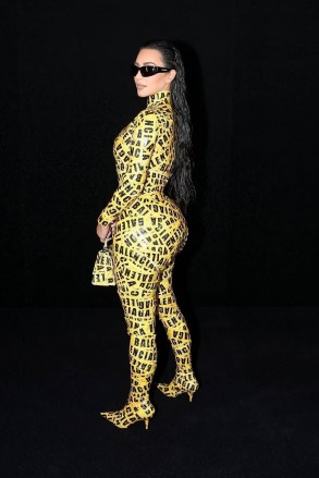 Paris, FRANCE  - *EXCLUSIVE*  - Kim Kardashian dons a yellow caution tape ensemble at the Balenciaga Fall/Winter 2022/2023 show during Paris Fashion Week at Le Bourget in Paris, France.Pictured: Kim KardashianBACKGRID USA 6 MARCH 2022 BYLINE MUST READ: Best Image / BACKGRIDUSA: +1 310 798 9111 / usasales@backgrid.comUK: +44 208 344 2007 / uksales@backgrid.com*UK Clients - Pictures Containing ChildrenPlease Pixelate Face Prior To Publication*