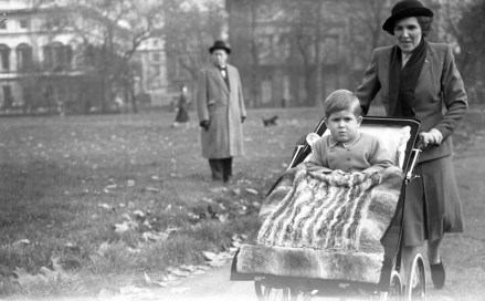 Prince Charles is pushed through Green Park today in his pram by his nanny Helen Lightbody on his third birthday.  Glass negative Prince Charles is pushed through Green Park today in his pram by his nanny Helen Lightbody on her third birthday.  glass negative