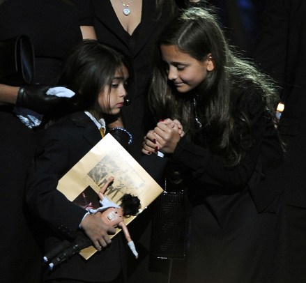 Michael Jackson's daughter Paris Katherine (R) holds hands with her younger brother Prince Michael Jackson II (also known as Blanket) at the memorial service for music legend Michael Jackson at Staples Center, Los Angeles on July 7, 2009 . "King of Pop" died in Los Angeles on June 25 at age 50. Michael Jackson Memorial Service, Los Angeles, California - July 7, 2009
