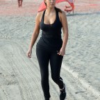 INF - Kim Kardashian Works Out On The Beach In Black Spandex And Hipster Glasses