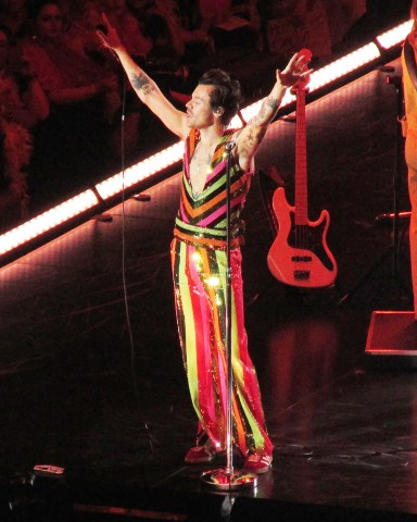 Harry Styles shows off his colorful style as she takes the stage for the 15th and final time at his record breaking residency inside Madison Square Garden in New York City. 22 Sep 2022 Pictured: Harry Styles. Photo credit: Brian Prahl/MEGA TheMegaAgency.com +1 888 505 6342 (Mega Agency TagID: MEGA900310_001.jpg) [Photo via Mega Agency]