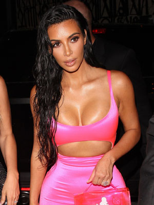 Kim sizzles in crop top and thong underwear as she licks cake frosting off  her fingers