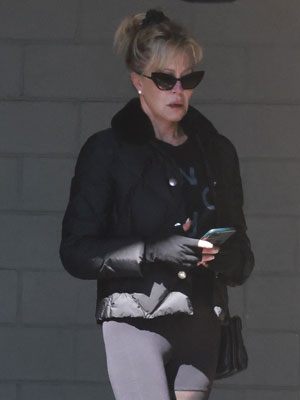 Melanie Griffith shows off her famous limbs in black leggings for All  Saints shop