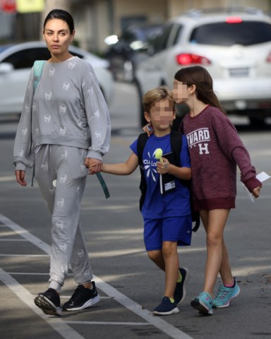 Los Angeles, CA - *EXCLUSIVE* - Mila Kunis wears a skull sweatsuit as she picks up her kids in Beverly Hills. Mila's daughter, Wyatt, showed what a good big sister she is by kissing her little brother on the forehead. Pictured: Mila Kunis BACKGRID USA 2 NOVEMBER 2022 BYLINE MUST READ: BACKGRID USA: +1 310 798 9111 / usasales@backgrid.com UK: +44 208 344 2007 / uksales@backgrid.com *UK Clients - Pictures Containing Children Please Pixelate Face Prior To Publication*