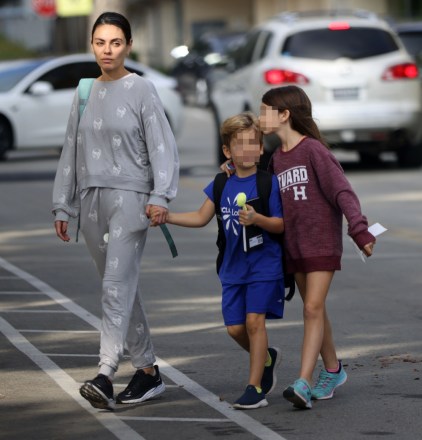 Los Angeles, CA - *EXCLUSIVE* - Mila Kunis wore a skull tracksuit while picking up her kids in Beverly Hills.  Mila's daughter, Wyatt, showed what a good sister she is by kissing her little brother on the forehead.  Photo: Mila Kunis BACKGRID USA November 2, 2022 MUST READ: BACKGRID USA: +1 310 798 9111 / usasales@backgrid.com United Kingdom: +44 208 344 2007 / uksales@backgrid.com *Guests UK - Image contains children Please pixelate faces Before Publishing*