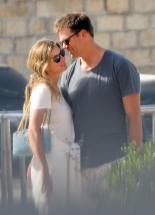 Saint-Tropez, FRANCE  - *EXCLUSIVE*  - Tom Brady cuddles up to his wife, Gisele Bunchchen, as the couple enjoys a romantic getaway to Saint Tropez. The Brazilian model smiled as Tom leaned in and whispered in her ear as the couple was spotted briefly over the weekend during a casual outing. The pair, who have been married for 13 years, has been enjoying some time together before Tom returns to the field again for his 23rd NFL season after initially announcing his retirement in February. The seven-time Super Bowl champion and five-time Super Bowl MVP announced roughly a month later that he'd changed his mind and would play another season with the Buccaneers.*PHOTOS SHOT ON 06/27/2022*Pictured: Gisele Bundchen, Tom BradyBACKGRID USA 29 JUNE 2022 BYLINE MUST READ: BACKGRIDUSA: +1 310 798 9111 / usasales@backgrid.comUK: +44 208 344 2007 / uksales@backgrid.com*UK Clients - Pictures Containing ChildrenPlease Pixelate Face Prior To Publication*