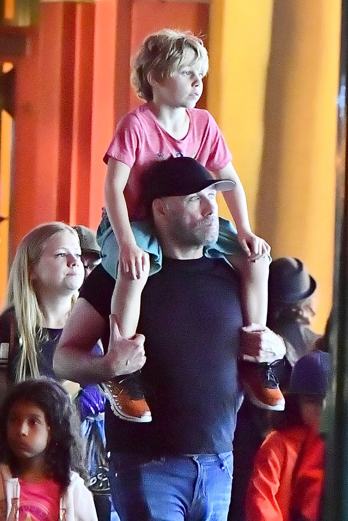 John Travolta takes his son Benjamin to the happiest place on earth