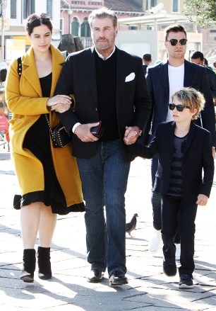 EXCLUSIVE: John Travolta is spotted in Venice with his kids Ella Bleu and Benjamin, where they are preparing to board the legendary train, The Orient Express. **SPECIAL INSTRUCTIONS*** Please pixelate children's faces before publication.**. 31 Oct 2018 Pictured: John Travolta, Ella Bleu, Benjamin. Photo credit: AMA / MEGA TheMegaAgency.com +1 888 505 6342 (Mega Agency TagID: MEGA300552_069.jpg) [Photo via Mega Agency]