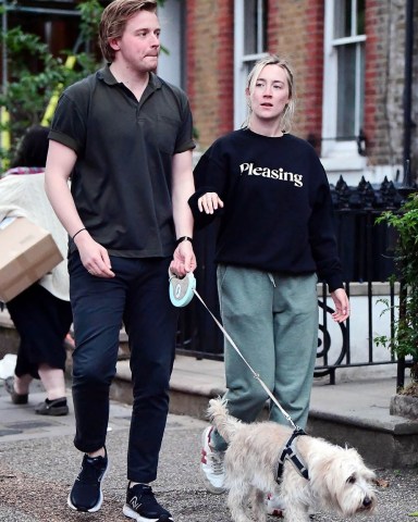 *EXCLUSIVE* London, UNITED KINGDOM  - The American-born Irish actress Saoirse Ronan famed for her roles in "Lady Bird", "The Grand Budapest Hotel" and nominated for best actress in a leading role at the 2020 Oscars for her role in "Little Women" was seen out with her beau, the Scottish actor Jack Lowden.  As both Saoirse and Jack donned a casual look whilst out walking with their new puppy, the pair looked loved up during their jaunt out in London.  It's a rather dressed down look for Saoirse as as reports claim that the acclaimed actress is joining pal Margot Robbie in Greta Gerwig's glamorous upcoming new movie "Barbie". *PHOTOS SHOT ON 06/09/2022*  Pictured: Saoirse Ronan, Jack Lowden  BACKGRID USA 12 JUNE 2022   BYLINE MUST READ: NASH / BACKGRID  USA: +1 310 798 9111 / usasales@backgrid.com  UK: +44 208 344 2007 / uksales@backgrid.com  *UK Clients - Pictures Containing Children Please Pixelate Face Prior To Publication*