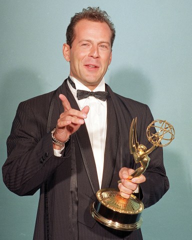 BRUCE WILLIS Bruce Willis proudly holds his Emmy for Best Actor in a Drama Series after he was honored by the Acadamy of Television Arts and Science at the Pasadena Civic Auditorium in Pasadena, Calif., on
BRUCE WILLIS EMMY AWARD, PASADENA, USA