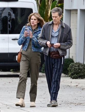 Studio City, CA  - *EXCLUSIVE*  - The "Footloose" star was sporting a pair of black crocs and striped pants as he filmed a new project alongside his daughter, Sosie Bacon. Sosie wears a denim jacket paired with olive green pants as she snacks while walking and talking next to dad.Pictured: Kevin Bacon, Sosie BaconBACKGRID USA 17 DECEMBER 2022 USA: +1 310 798 9111 / usasales@backgrid.comUK: +44 208 344 2007 / uksales@backgrid.com*UK Clients - Pictures Containing ChildrenPlease Pixelate Face Prior To Publication*