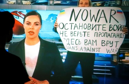 A woman watches a recorded feed of the Russian Channel One's evening news broadcast TV show in which an employee enters Ostankino on-air TV studio with a poster reading ''No War. Stop the war. Don't believe the propaganda. You are being lied to here" in Moscow, Russia, 15 March 2022. The on-air protest was staged on 14 March by Marina Ovsyannikova, who worked as an editor. She was taken to the Ostankino police department. A protocol was drawn up against an employee of Channel One under the article on military censorship for discrediting the Russian armed forces. On 24 February Russian troops had entered Ukrainian territory in what the Russian president declared a 'special military operation', resulting in fighting and destruction in the country, a huge flow of refugees, and multiple sanctions against Russia.
The on-air protest on Russian TV against Russian military operation in Ukraine, Moscow, Russian Federation - 15 Mar 2022