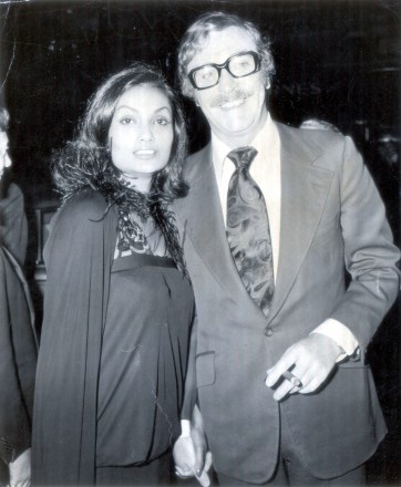 British Actor Michael Caine With His Wife Shakira At Premiere Of The Film That's Entertainment In 1974. 
British Actor Michael Caine With His Wife Shakira At Premiere Of The Film That's Entertainment In 1974.