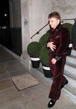 London, UK - *EXCLUSIVE* - Madonna and Guy Ritchie's son Rocco Ritchie looks dapper in his red velvet suit as he leaves Twenty Two hotel, bar and restaurant at 02:30am with girlfriend Kim Turnbull .  Rocco was seen at an evening hosting his art exhibition and it seems that the exhibition is a general success as sister Lourdes reportedly praised his unique paintings.  Photo: Rocco Ritchie BACKGRID USA MAY 13, 2022 USA: +1 310 798 9111 / usasales@backgrid.com UK: +44 208 344 2007 / uksales@backgrid.com