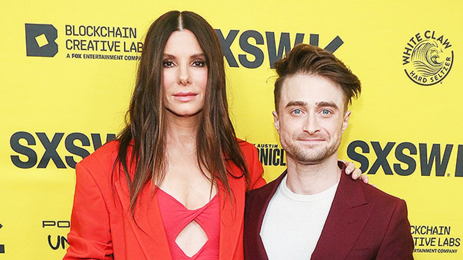 Sandra Bullock Wears Orange Top While At SXSW With Daniel Radcliffe