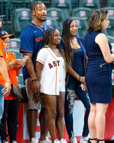 Newly engaged gymnast Simone Biles And Her  Fiance Jonathan Owens Watch A Baseball Game In Houston. The Olympic hero, 25, was spotted court side during opening day at Minute Maid Park where the Houston Astros took on the Los Angeles Angel of Anaheim. She flashed her dazzling engagement ring and was all smiles as she enjoyed the event with her beau.  Pictured: Simone Biles,Jonathan Owens Ref: SPL5304675 180422 NON-EXCLUSIVE Picture by: F. Carter Smith / Splash / SplashNews.com  Splash News and Pictures USA: +1 310-525-5808 London: +44 (0)20 8126 1009 Berlin: +49 175 3764 166 photodesk@splashnews.com  World Rights