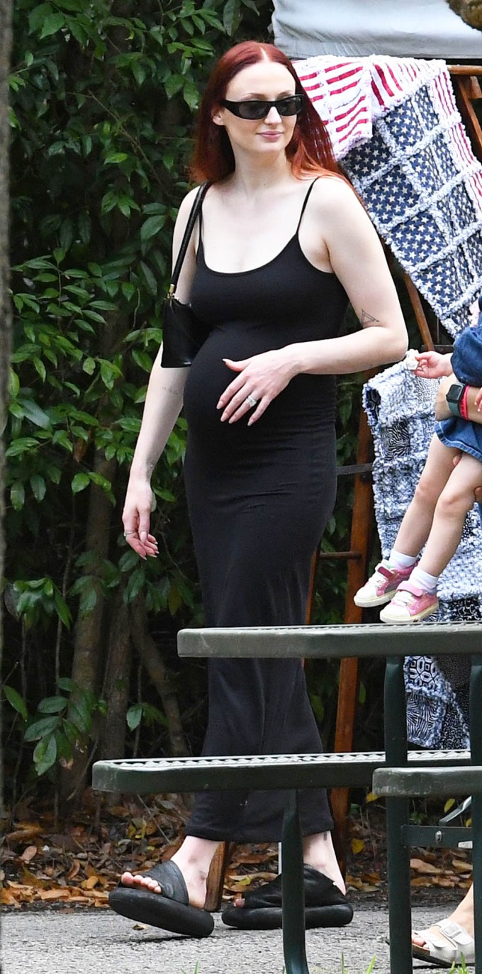 Sophie Turner Cradles Baby Bump While Shopping