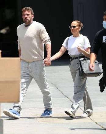 Jennifer Lopez and Ben Affleck spotted at   Red Studios in Hollywood.The power couple color coordinated in grey pants as they stepped out to visit the movie studio on Tuesday, holding hands as they arrived.Pictured: ben affleck,jennifer lopezRef: SPL5307541 030522 NON-EXCLUSIVEPicture by: MESSIGOAL / SplashNews.comSplash News and PicturesUSA: +1 310-525-5808London: +44 (0)20 8126 1009Berlin: +49 175 3764 166photodesk@splashnews.comWorld Rights