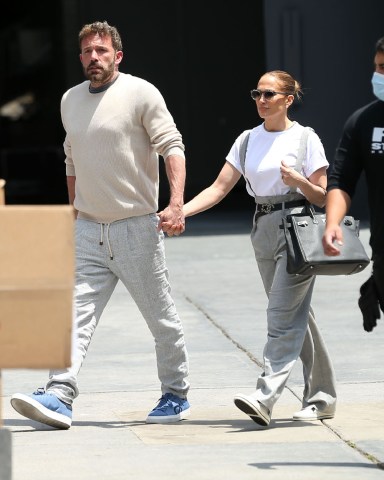 Jennifer Lopez and Ben Affleck spotted at   Red Studios in Hollywood. The power couple color coordinated in grey pants as they stepped out to visit the movie studio on Tuesday, holding hands as they arrived.  Pictured: ben affleck,jennifer lopez Ref: SPL5307541 030522 NON-EXCLUSIVE Picture by: MESSIGOAL / SplashNews.com  Splash News and Pictures USA: +1 310-525-5808 London: +44 (0)20 8126 1009 Berlin: +49 175 3764 166 photodesk@splashnews.com  World Rights