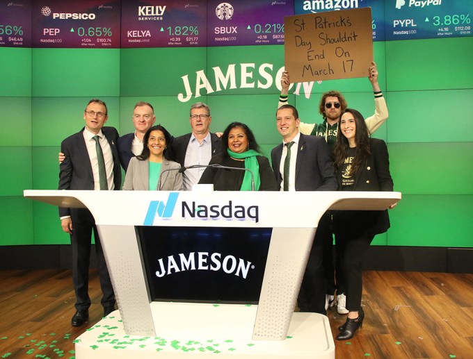 Dude With Sign Photobombs as Jameson Irish Whiskey Executives Ring the NASDAQ Closing Bell