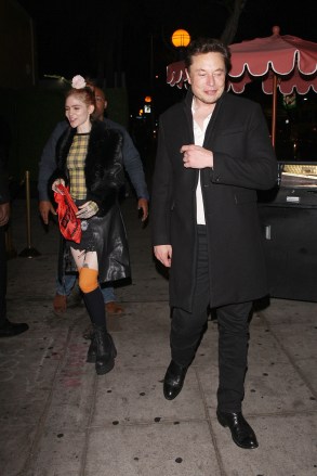 EXCLUSIVE: Elon Musk is spotted leaving the Delilah club with his new girlfriend and Canadian singer Grimes in West Hollywood. Elon and his girlfriend were escorted by his two bodyguards to his car as they left the club. At first, the couple were a little camera shy but slowly warmed up to it. The couple arrived to the club at 11 P.M. and left at 12:30 A.M. 05 Aug 2018 Pictured: Elon Musk And Grimes. Photo credit: MEGA TheMegaAgency.com +1 888 505 6342 (Mega Agency TagID: MEGA260004_001.jpg) [Photo via Mega Agency]