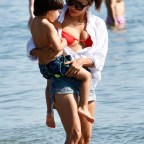 Eva Longoria hits the beach with her husband José Bastón and their 4 year old son Santiago Enrique Bastón while on vacation in Marbella, Spain