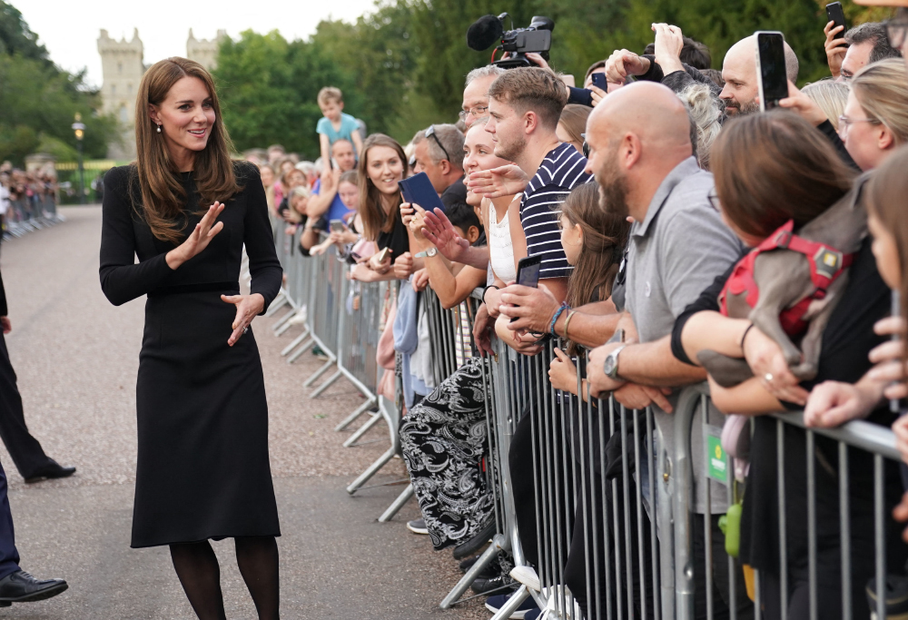 The Princess of Wales, the Prince of Wales and the Duke and Duchess of Sussex meeting members of the public at Windsor Castle in Berkshire following the death of Queen Elizabeth II on Thursday.