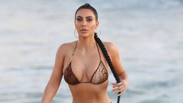 Kim Kardashian almost slips out of leather bikini top as she arrives