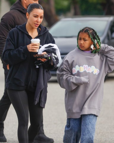 Los Angeles, CA  - Supermodel/entreprenuer/full-time mom, Kim Kardashian, arrives at her son Saint's soccer game in Los Angeles alongside daughter North West. Kim and North sipped on hot beverages as they met up with Saint and his teammate before the kick-off.Pictured: Kim Kardashian, North West BACKGRID USA 27 MARCH 2022 USA: +1 310 798 9111 / usasales@backgrid.comUK: +44 208 344 2007 / uksales@backgrid.com*UK Clients - Pictures Containing ChildrenPlease Pixelate Face Prior To Publication*