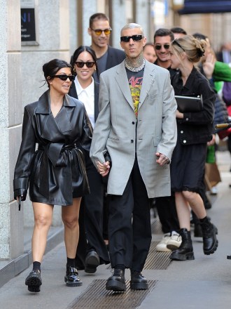 Kourtney Kardashian and Travis Barker walking through the streets of the center, with some bodyguards in tow, holding tenderly hand in hand for the whole walk, until they reach the hotel where they are staying.Kourtney Kardashian and Travis Barker take a walk in Milan, Italy - 27 Apr 2022