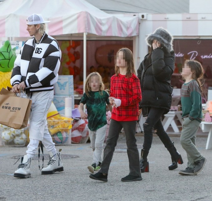*EXCLUSIVE* Machine Gun Kelly and Megan Fox take her kids and mother Christmas shopping in Malibu