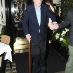 Michael Caine Seen Being Aided Out Of Scotts Restaurant In Mayfair Following His Operation