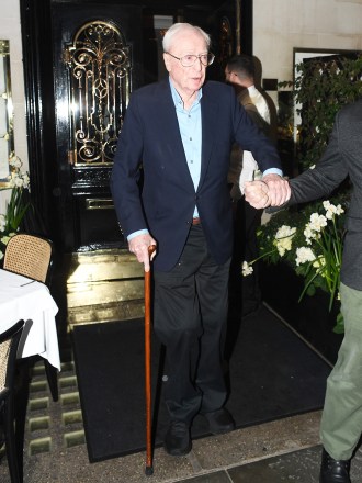 British Actor Michael Caine seen being aided out of Scotts restaurant in Mayfair following his operation. Michael Caine was joined by his wife Shakira Caine as the pair enjoyed a dinner date in the capital. Michael 89, was seen waving goodbye to photographers as he left the eatery following his dinner.Pictured: Michael CaineRef: SPL5300517 310322 NON-EXCLUSIVEPicture by: SplashNews.comSplash News and PicturesUSA: +1 310-525-5808London: +44 (0)20 8126 1009Berlin: +49 175 3764 166photodesk@splashnews.comWorld Rights