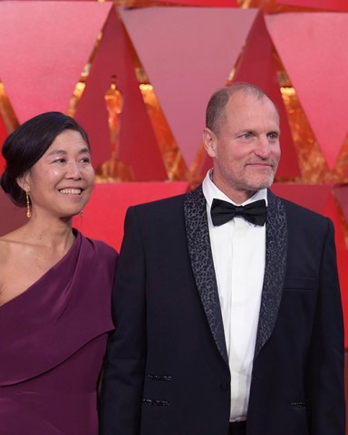 Laura Louie, Woody Harrelson. Laura Louie, left, and Woody Harrelson arrive at the Oscars, at the Dolby Theatre in Los Angeles
90th Academy Awards - Arrivals, Los Angeles, USA - 04 Mar 2018